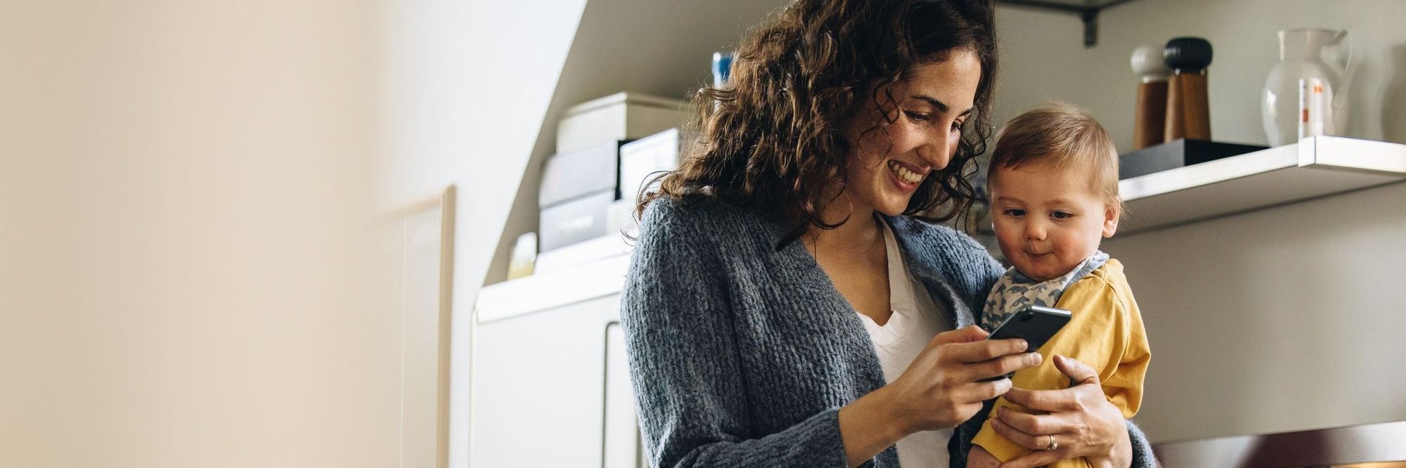 Young mother starts a DermatologistOnCall visit for her infant with a facial rash.