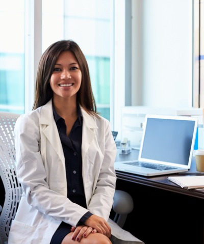 Female dermatologist sitting near her computerp