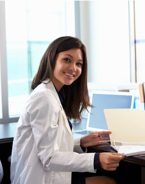 Female dermatologist reviewing an online visit.